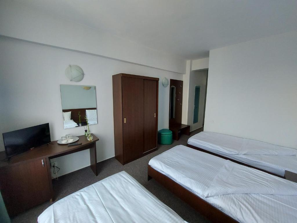 Postel nebo postele na pokoji v ubytování Elizeu Hotel