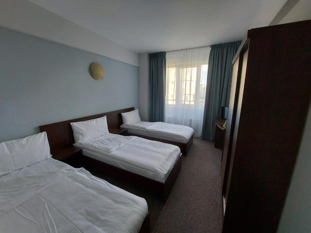 Postel nebo postele na pokoji v ubytování Elizeu Hotel