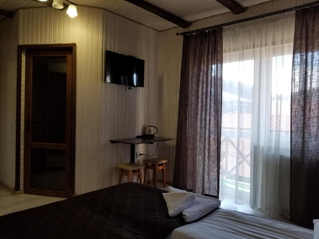 Postel nebo postele na pokoji v ubytování Guest House Mountain