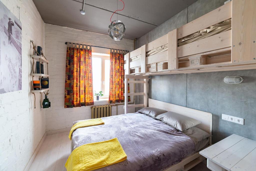 a bedroom with a large bed and a window at Wasser отель, трасса M4 in Voronezh