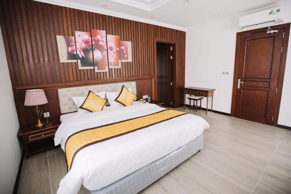 Postelja oz. postelje v sobi nastanitve FLC Villa Hạ Long 4 Phòng Ngủ
