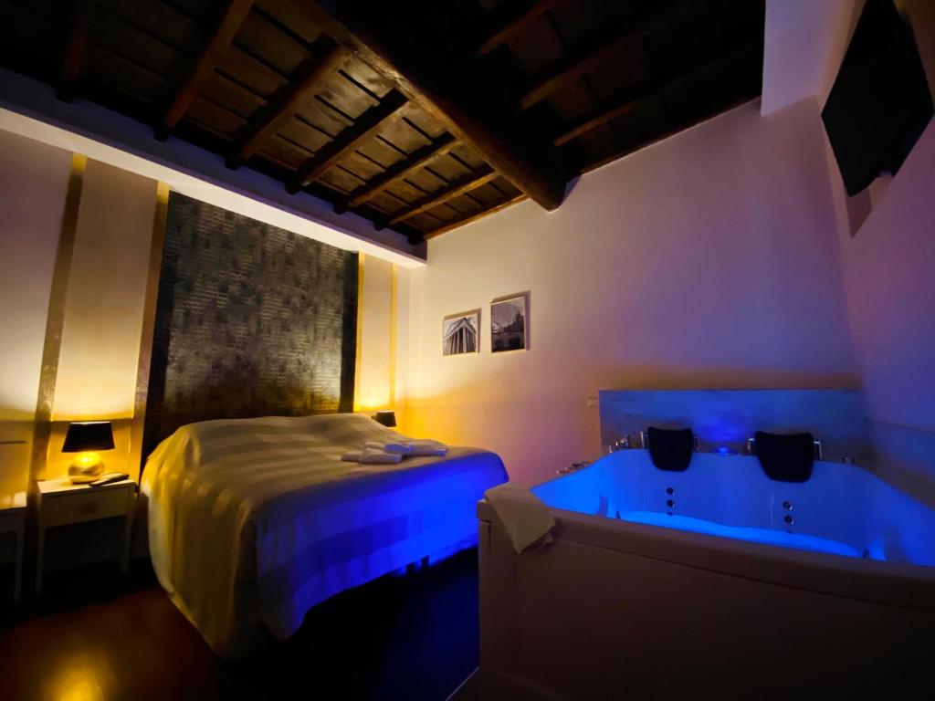 En eller flere senge i et værelse på Campo Marzio Hotelier