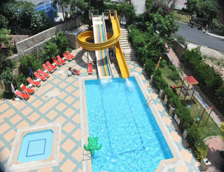 a swimming pool with a slide and a water park at BEST HOUSE APART HOTEL-2 in Alanya