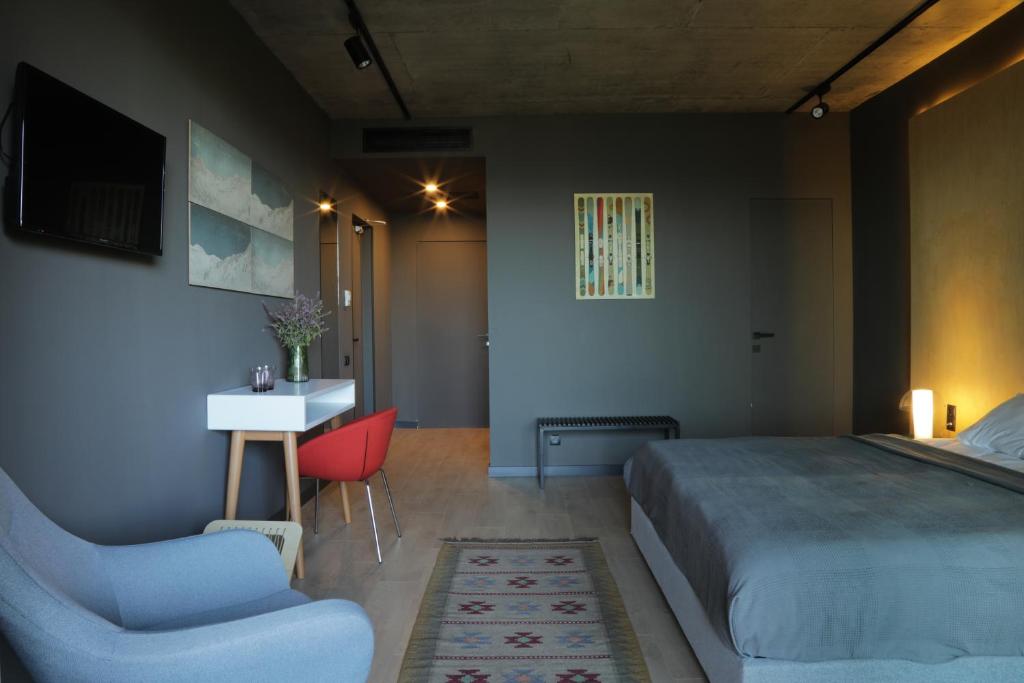 Postel nebo postele na pokoji v ubytování Quadrum Hotel