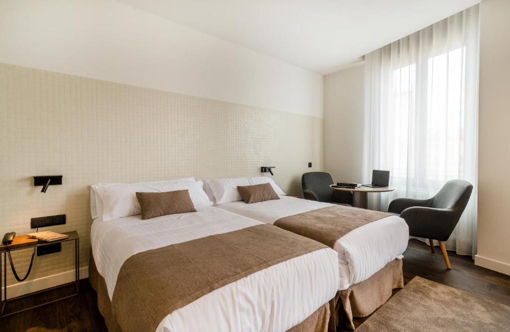 Postel nebo postele na pokoji v ubytování Peninsular