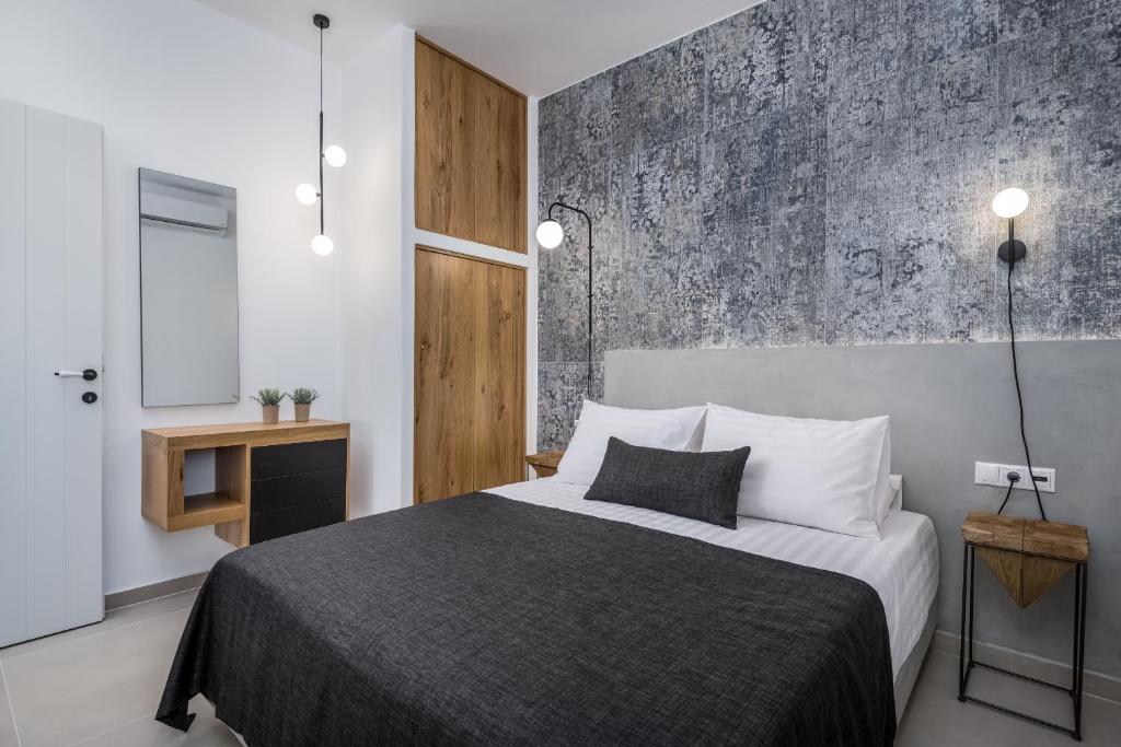 Postel nebo postele na pokoji v ubytování Remezzo Bayfront Suites
