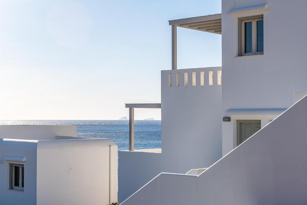a view of the ocean from a house at Remezzo Bayfront Suites in Livadi Astypalaias