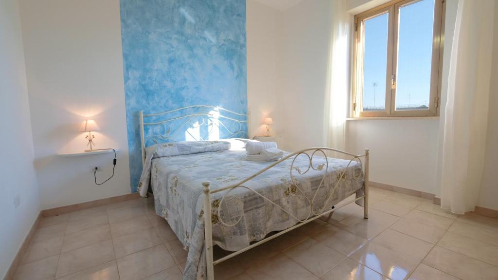 Postel nebo postele na pokoji v ubytování Apartment Mikao - Torre Pali