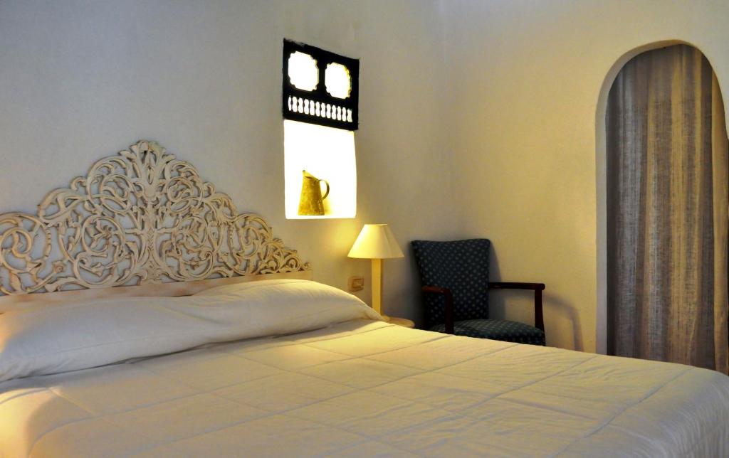 Postel nebo postele na pokoji v ubytování Hotel Dar Dhiafa