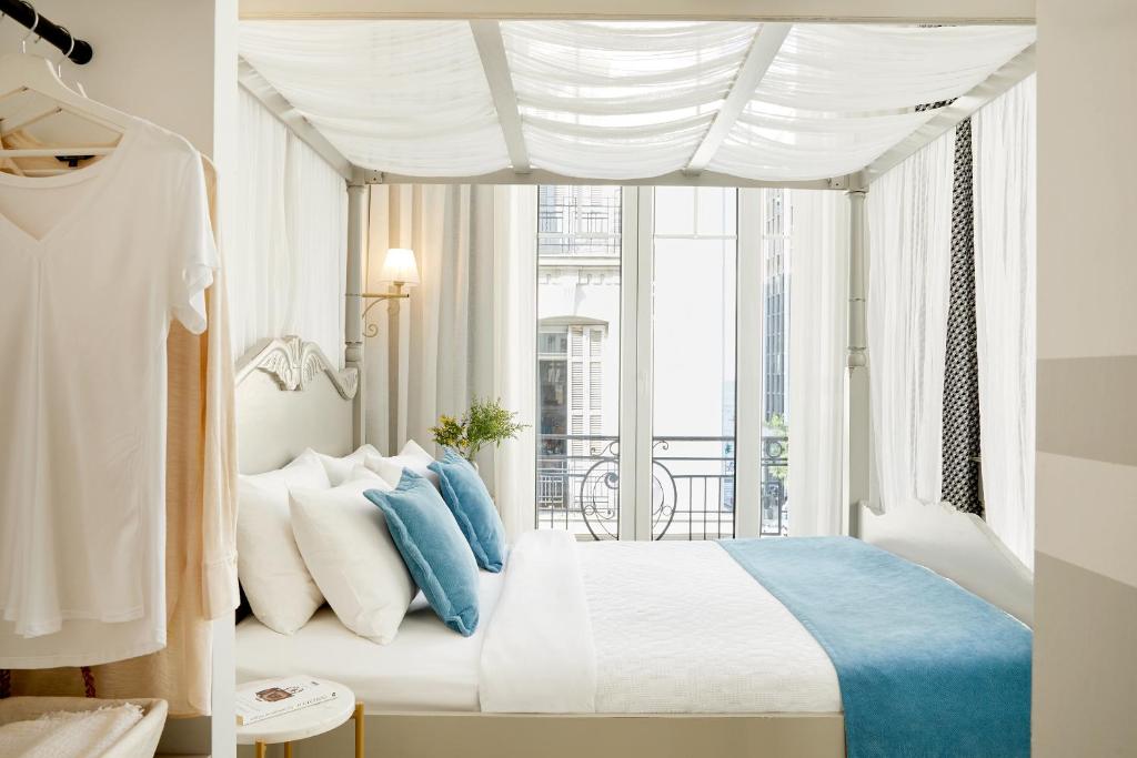 Posteľ alebo postele v izbe v ubytovaní Hotel Luxembourg