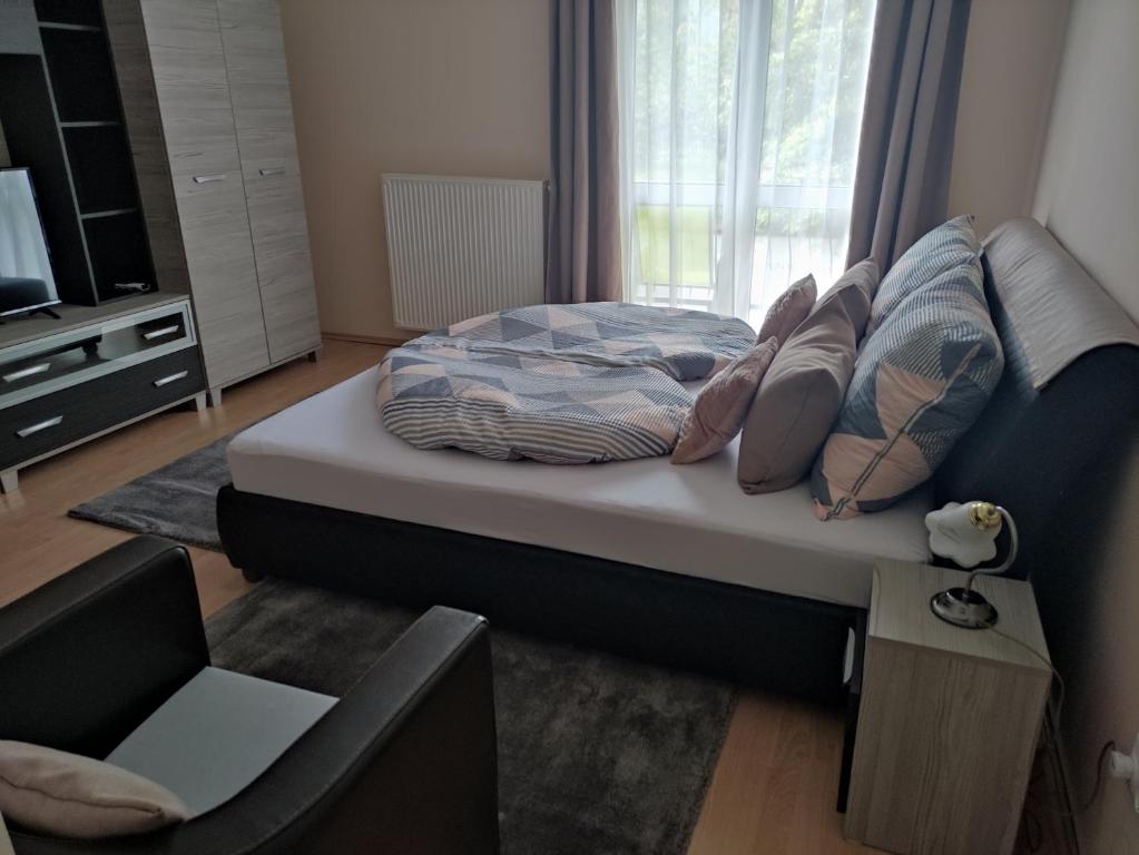 Postel nebo postele na pokoji v ubytování Zsanett Appartement
