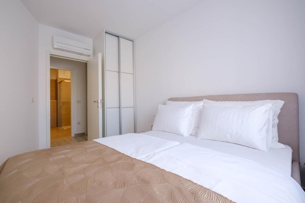 Posteľ alebo postele v izbe v ubytovaní MB Luxury Apartments