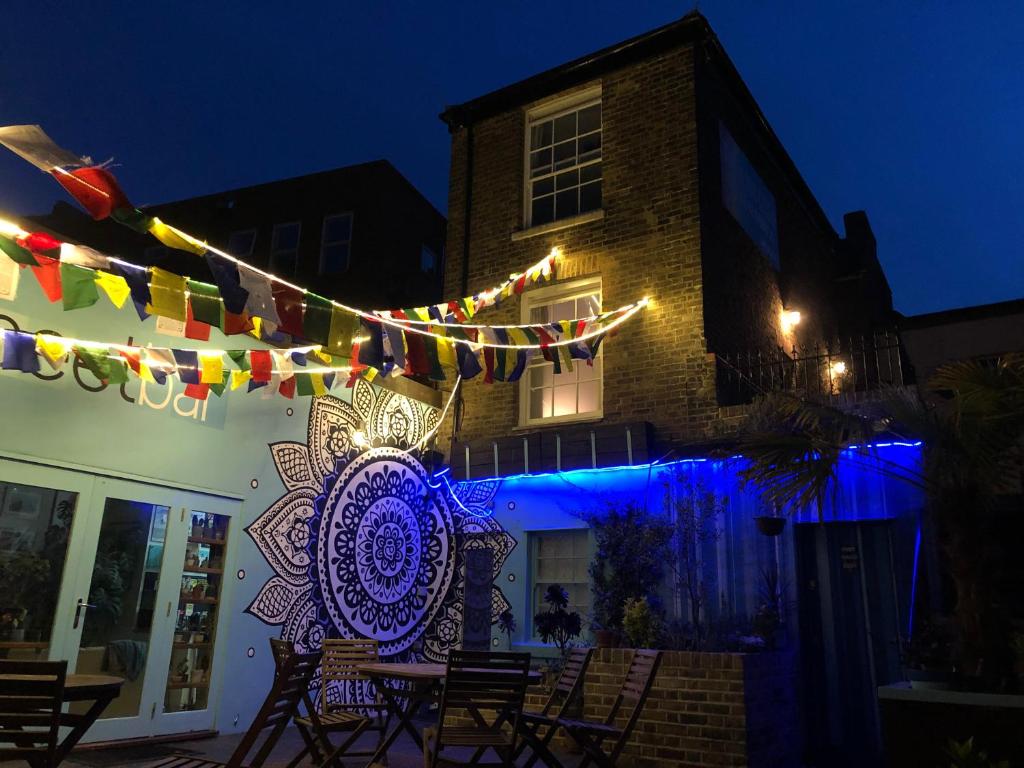 a building with a bunch of flags and lights at The Beetroot in Margate