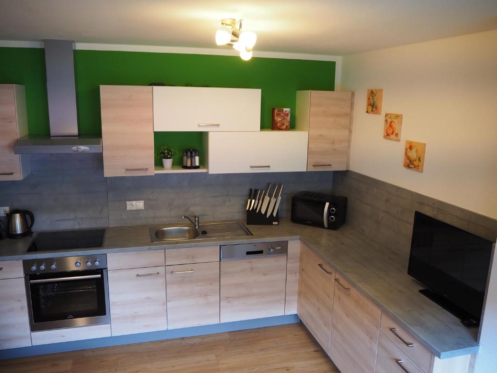Kuchyň nebo kuchyňský kout v ubytování Apart Kristall