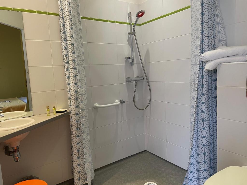 Koupelna v ubytování Hôtel Mirano