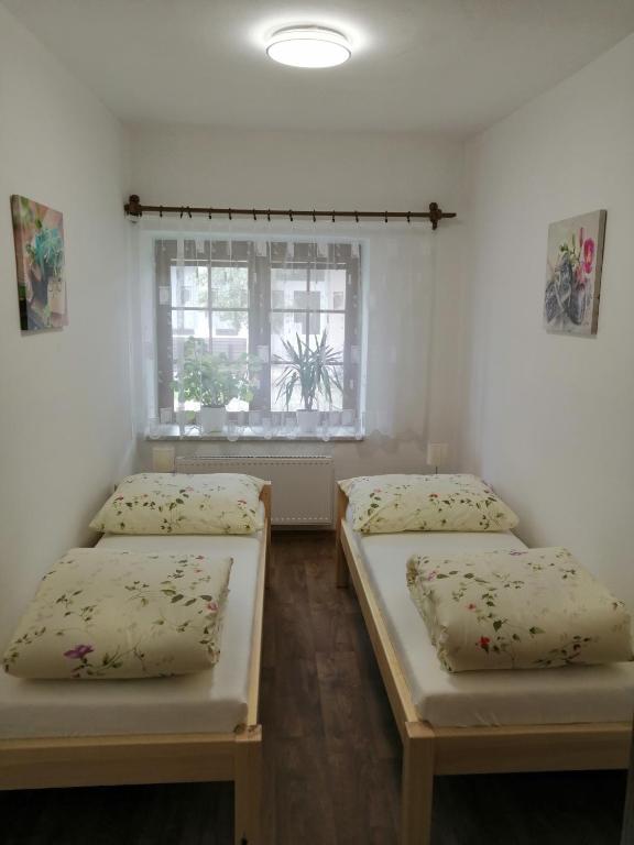 Postel nebo postele na pokoji v ubytování Apartmány 62