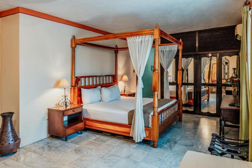 Postel nebo postele na pokoji v ubytování Casa del Balam Merida