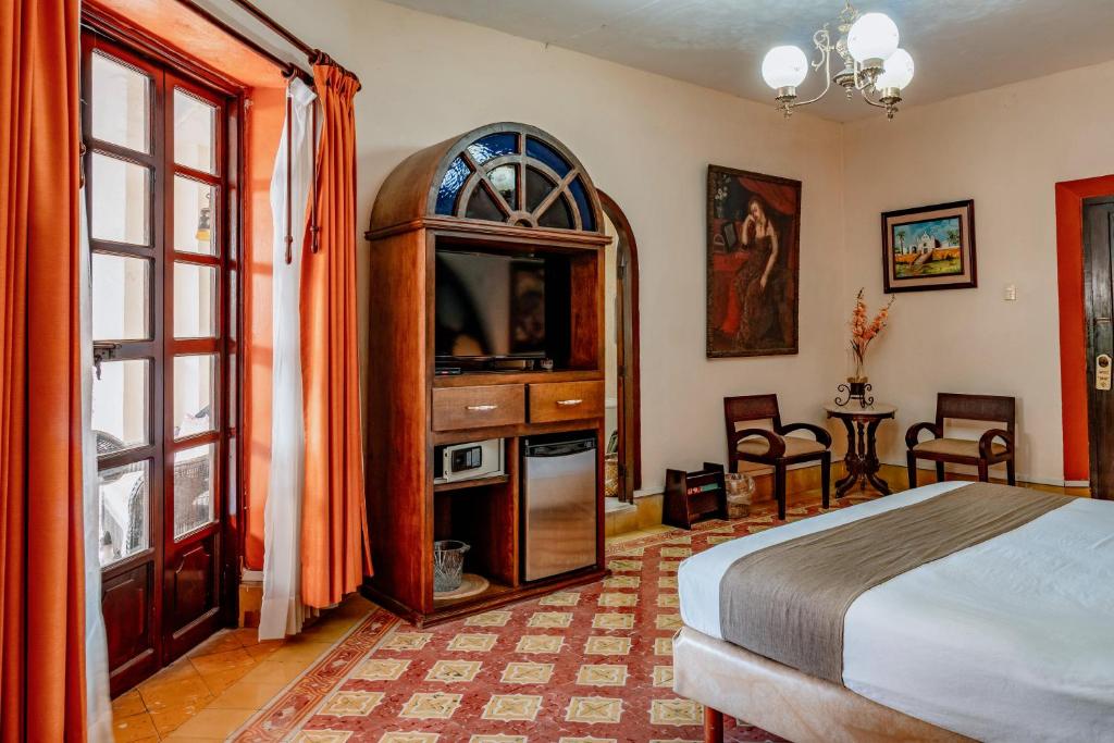 Postel nebo postele na pokoji v ubytování Casa del Balam Merida