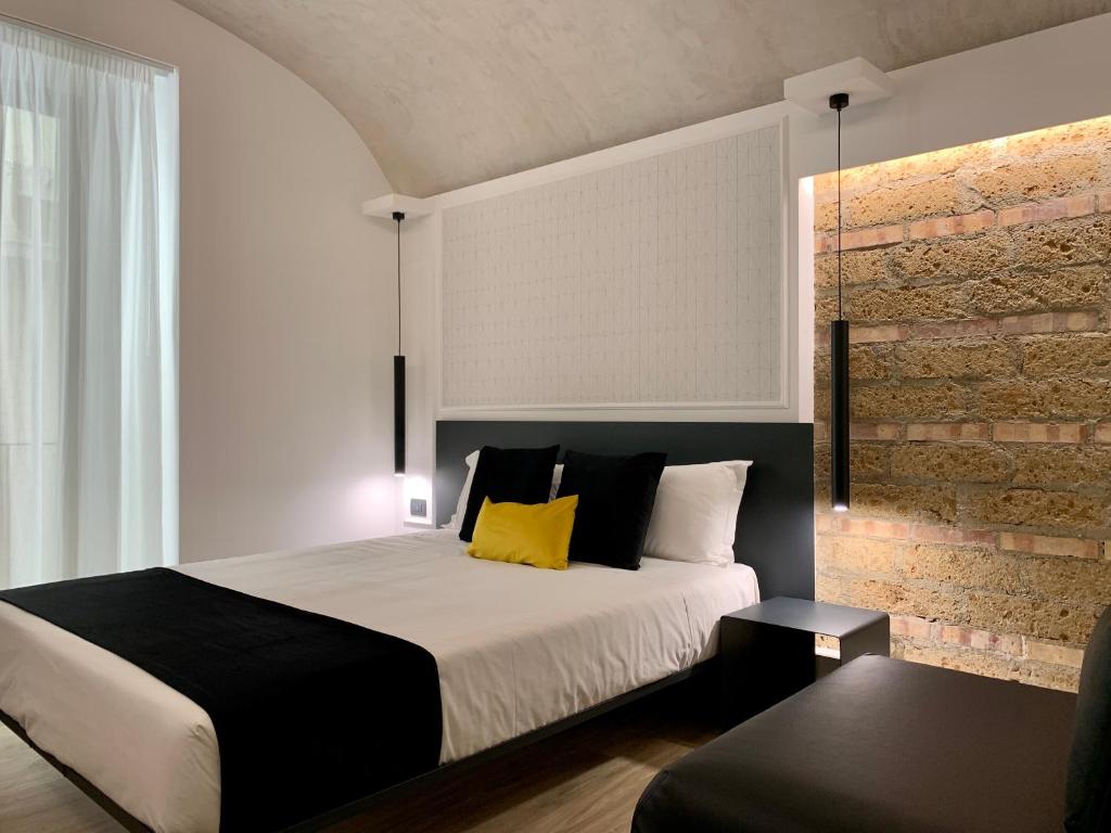 Postel nebo postele na pokoji v ubytování Toledo Boutique Rooms