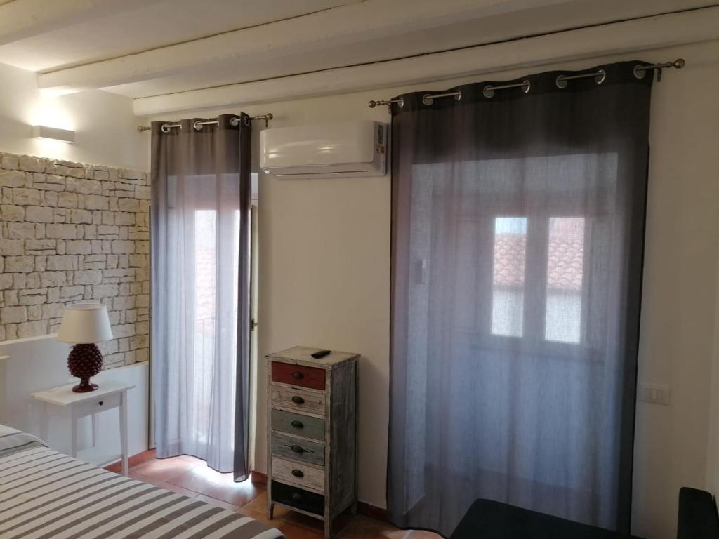 Posteľ alebo postele v izbe v ubytovaní MOLO 78 Case Vacanze