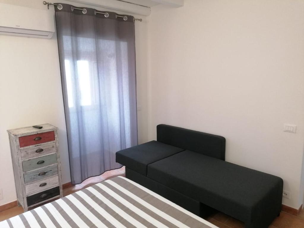 Posteľ alebo postele v izbe v ubytovaní MOLO 78 Case Vacanze