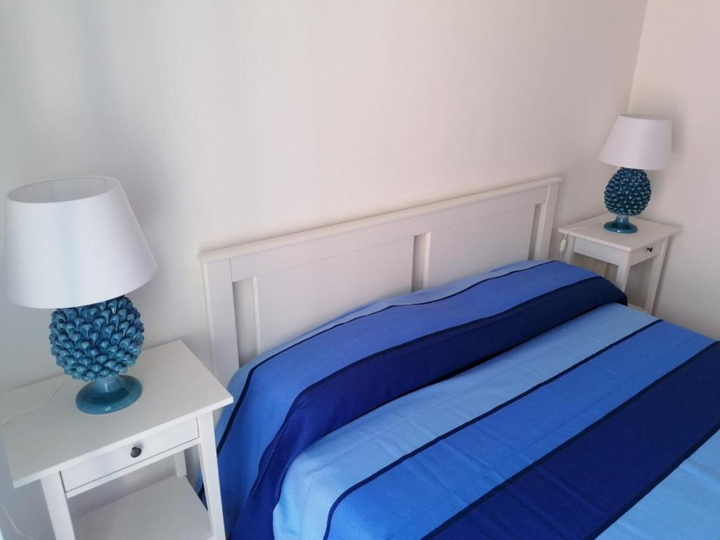 Posteľ alebo postele v izbe v ubytovaní MOLO 78 Case Vacanze