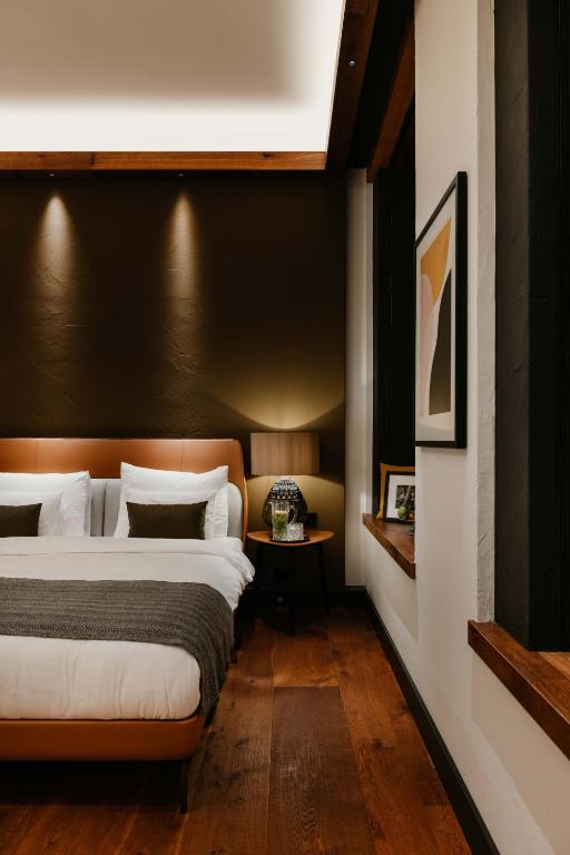 Postel nebo postele na pokoji v ubytování DO & CO Hotel München