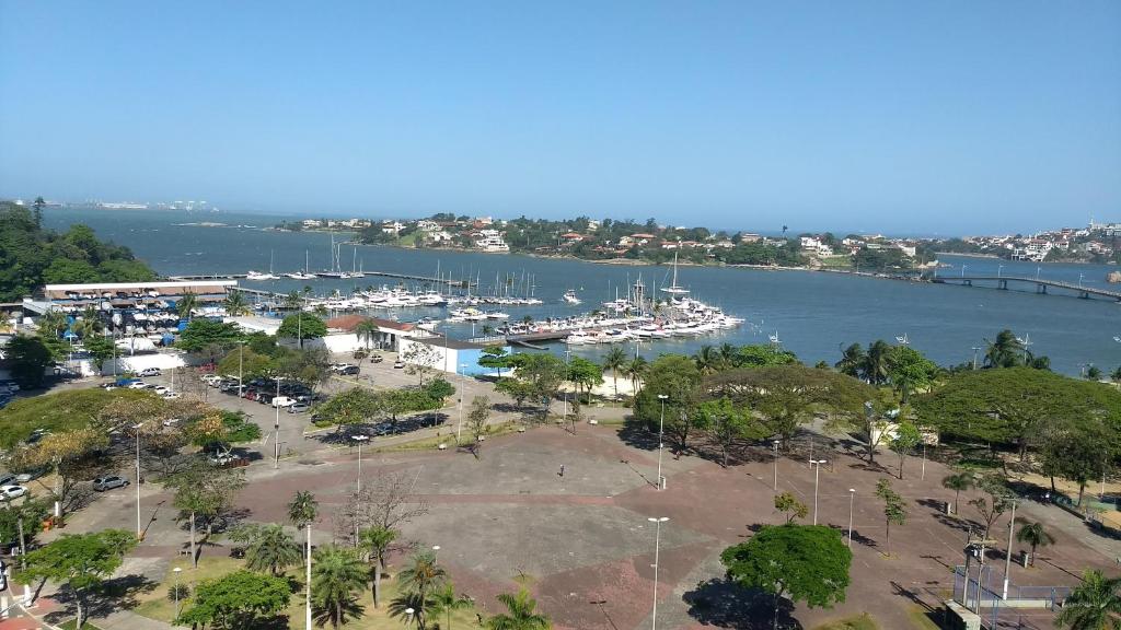an aerial view of a marina with boats in the water at Bristol Praia do Canto Apart Hotel in Vitória