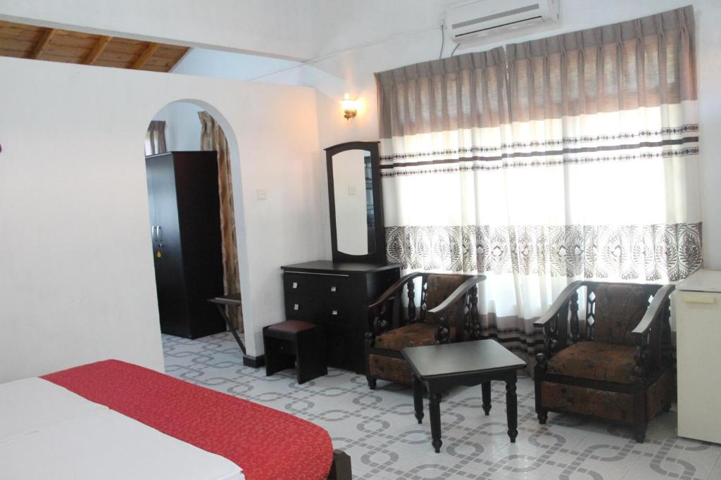 Postel nebo postele na pokoji v ubytování Hotel Thai Lanka