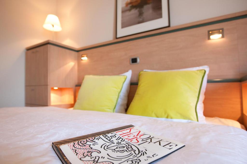 Postel nebo postele na pokoji v ubytování Hotel Van Bunnen