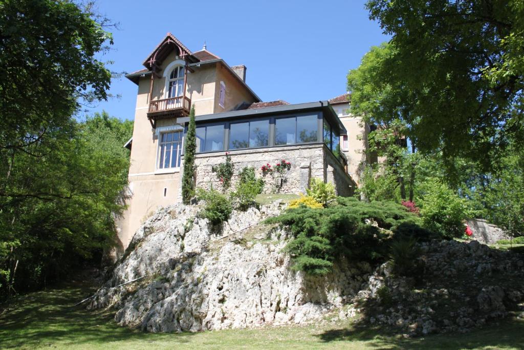 a house on top of a rock at La Garenne de Morestel in Morestel