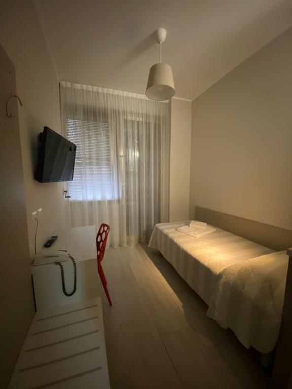 Postel nebo postele na pokoji v ubytování Hotel Due Giardini