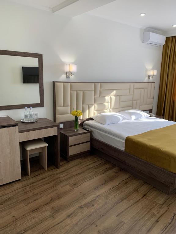 Postel nebo postele na pokoji v ubytování Vertoni Hotel Yerevan