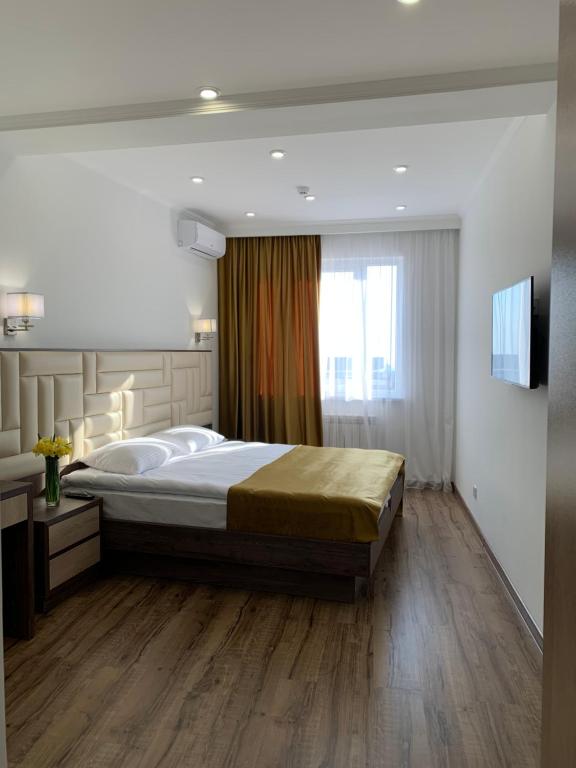 Postel nebo postele na pokoji v ubytování Vertoni Hotel Yerevan