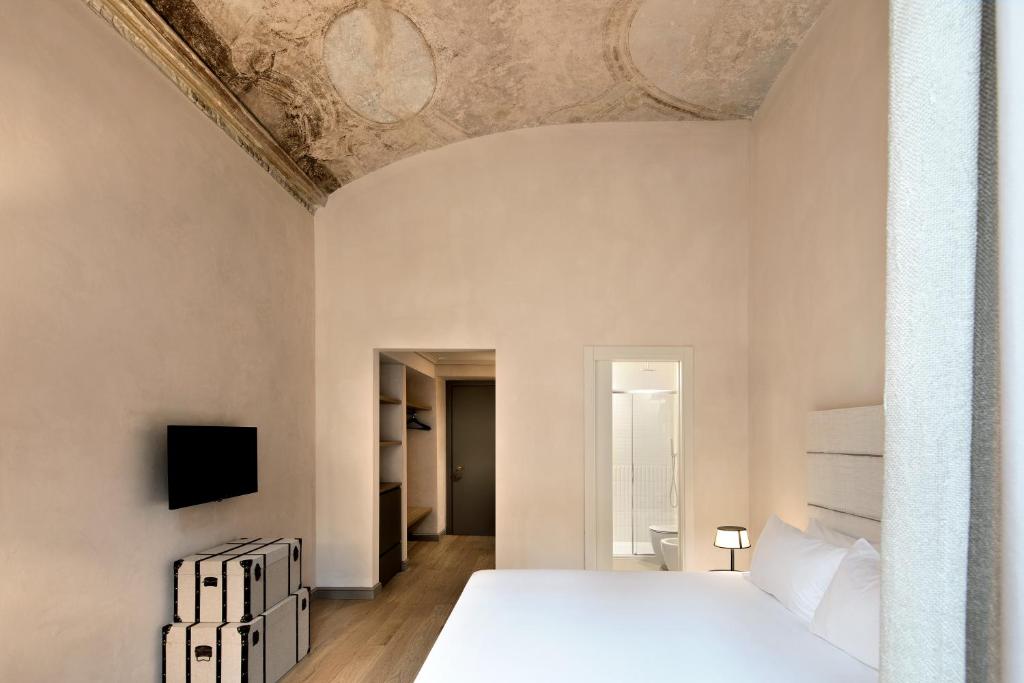 Postel nebo postele na pokoji v ubytování Opera35 Boutique Hotel