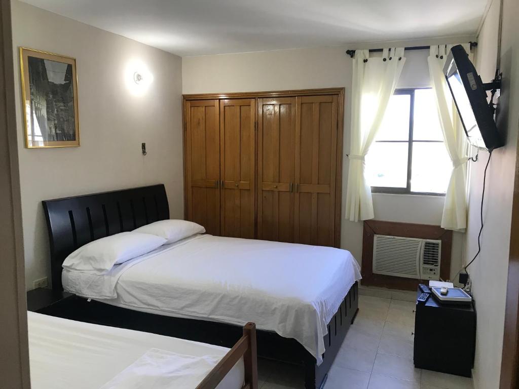 Postel nebo postele na pokoji v ubytování Apartamento Los Laureles Rodadero