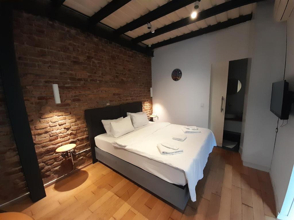 A bed or beds in a room at Taxim No18 Boutique Hotel