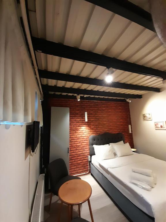 A bed or beds in a room at Taxim No18 Boutique Hotel