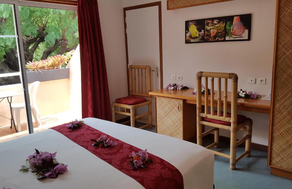 Uma cama ou camas num quarto em Hotel Hibiscus