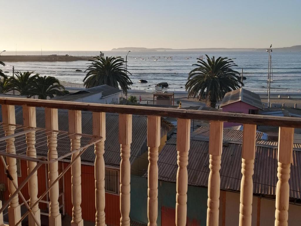 a view of the beach from a balcony at Casas y cabañas Nofal in Los Vilos