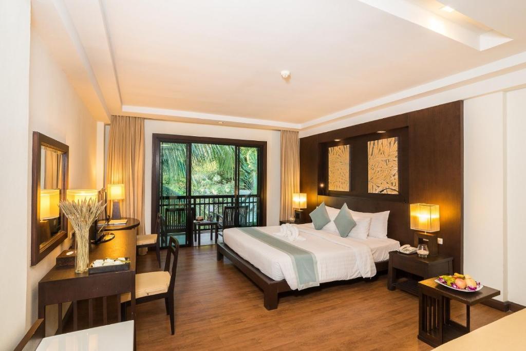 Postel nebo postele na pokoji v ubytování KC Grande Resort Koh Chang