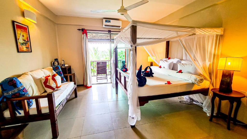 Postel nebo postele na pokoji v ubytování The Zanzibari