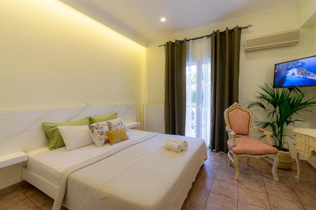 Ένα ή περισσότερα κρεβάτια σε δωμάτιο στο Villas Margaris
