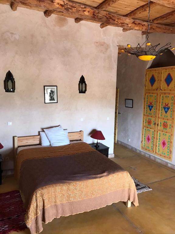 Postel nebo postele na pokoji v ubytování Kasbah Timdaf