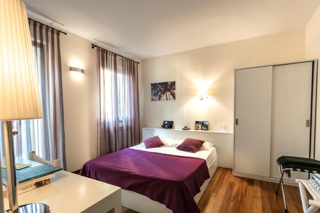 Postel nebo postele na pokoji v ubytování Oasi Hotel