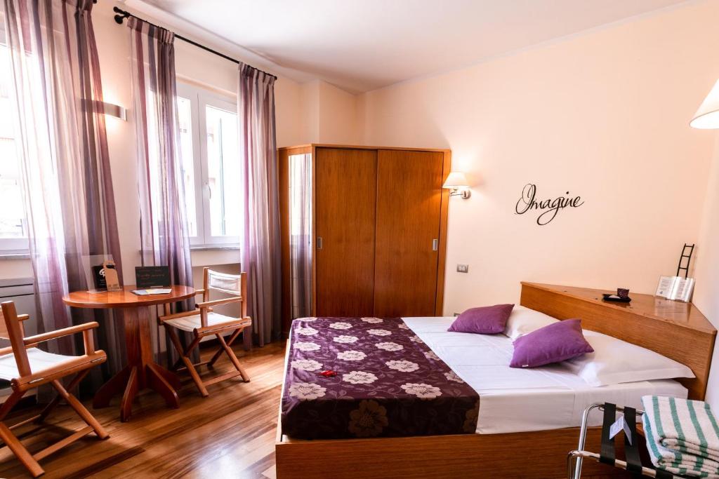 Postel nebo postele na pokoji v ubytování Oasi Hotel