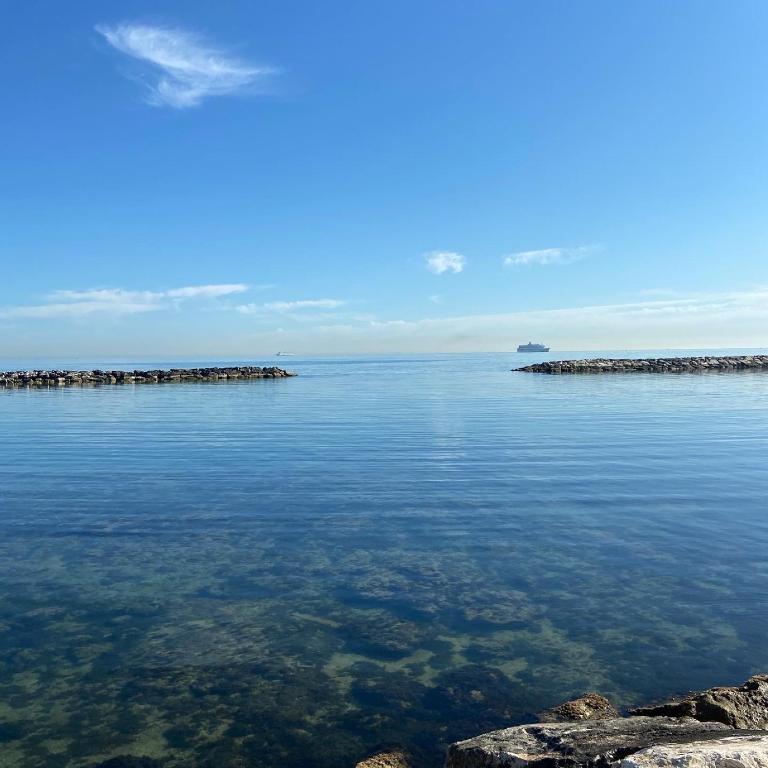 a large body of water with some rocks in it at Bari Lory’s Home in Bari