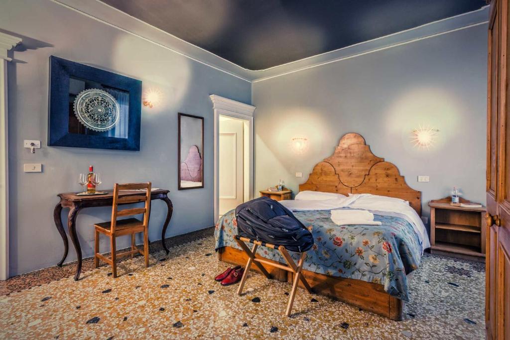 Postel nebo postele na pokoji v ubytování Alloggi B&b Allegri