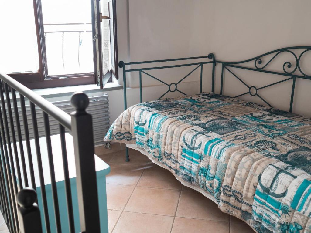 Una cama o camas en una habitación de IL GRECALE - ConfirentHouse