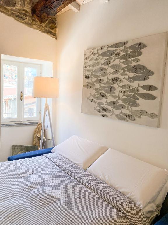 Postel nebo postele na pokoji v ubytování La Polena Camere Vernazza - Carattino Apartment